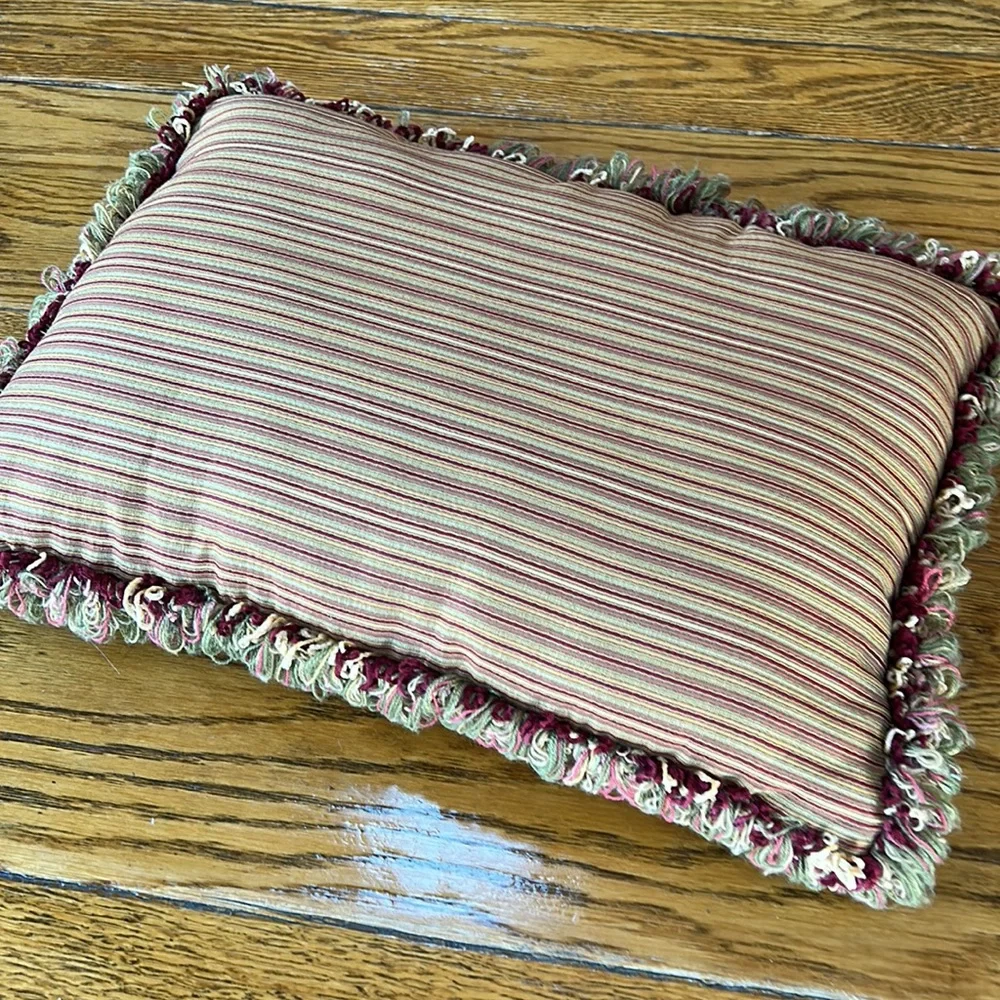 Striped gold/wine accent pillow with fringe.  Size is 14” x 18”